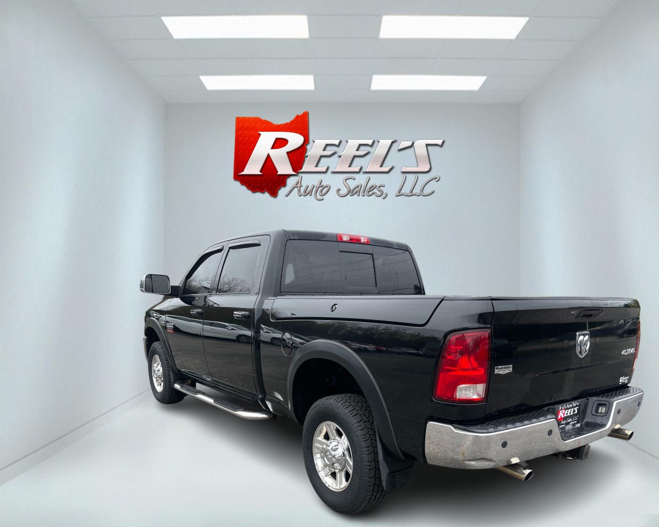 2012 Black /Black Dodge Ram 2500 Laramie Crew Cab SWB 4WD (3C6TD5FT6CG) with an 5.7L V8 OHV 16V engine, 6-Speed Automatic transmission, located at 547 E. Main St., Orwell, OH, 44076, (440) 437-5893, 41.535435, -80.847855 - This 2012 Dodge Ram 2500 Laramie Crew Cab is a heavy-duty pickup truck designed for serious towing and hauling capabilities. Powered by a 5.7L HEMI V8 engine mated to a 6-speed automatic transmission and 3.73 gearing, it boasts an impressive 10,550-pound towing capacity. The interior is well-appoint - Photo#7